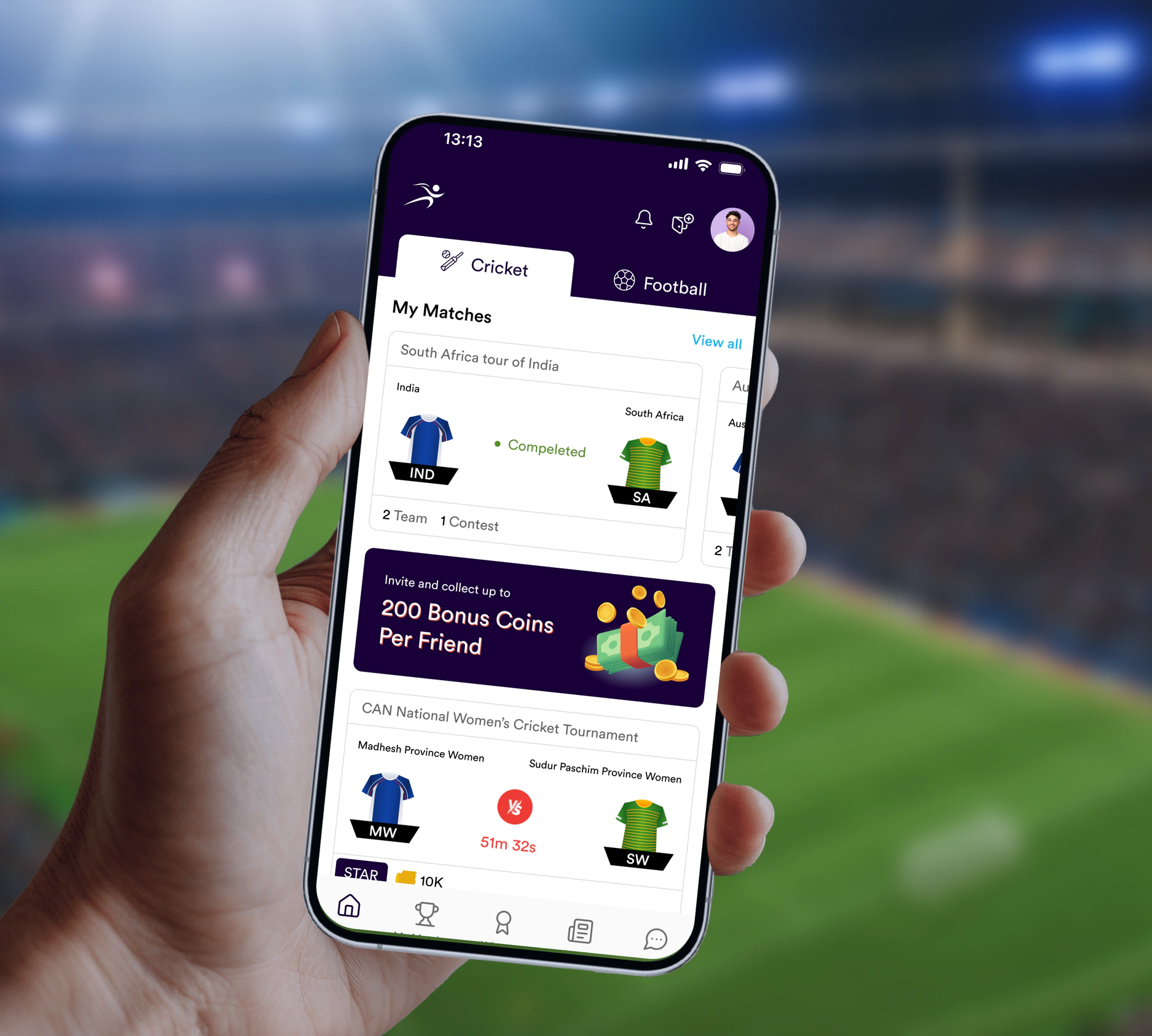 A hand holding a phone showing the Strike11 fantasy sports app's My Matches screen, in front of a stadium